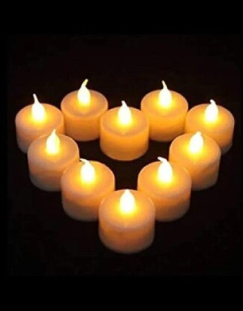 Set of lit candles arranged in a circular pattern on a dark background