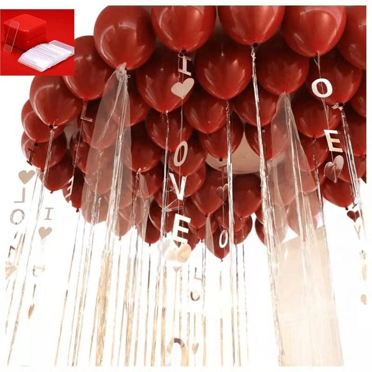 Red heart-shaped balloons with 'I LOVE YOU' tassels on a white background