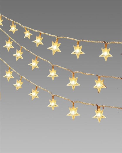Star-shaped string lights on a gray background
