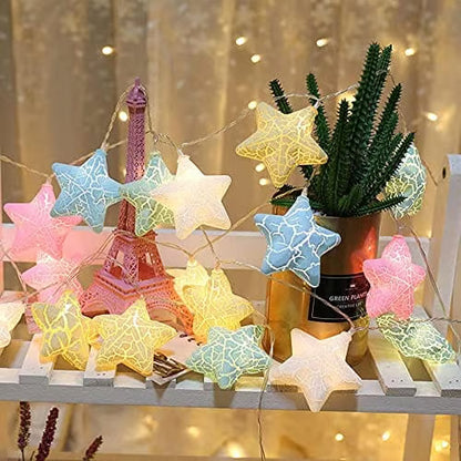 Star-shaped string lights on a decorative surface with a blurred background
