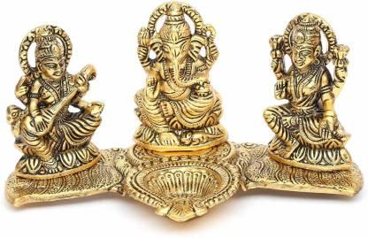 Set of three gold-colored神像 statues on a decorative stand with a white background