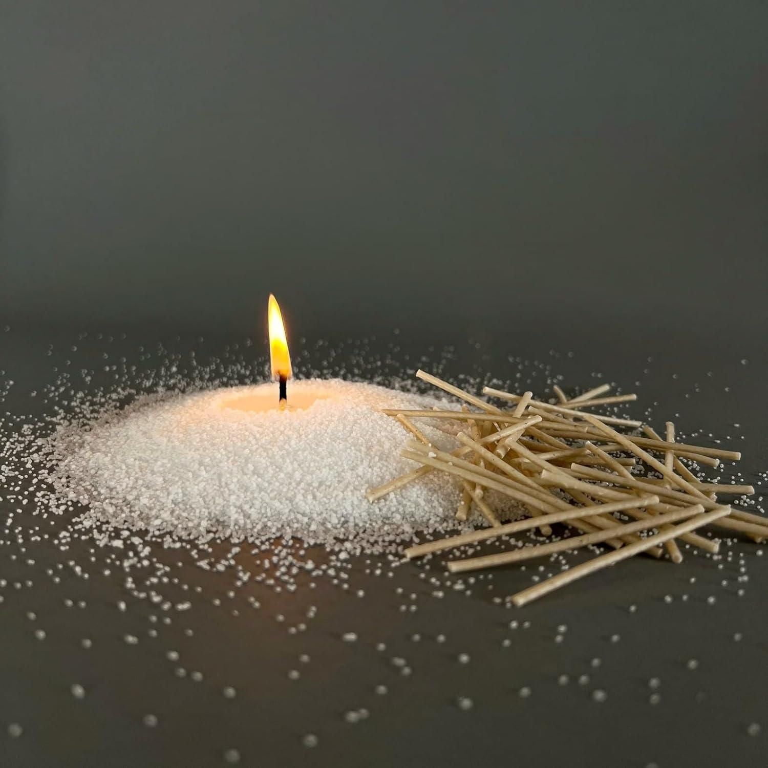 Candle with matches on a dark background